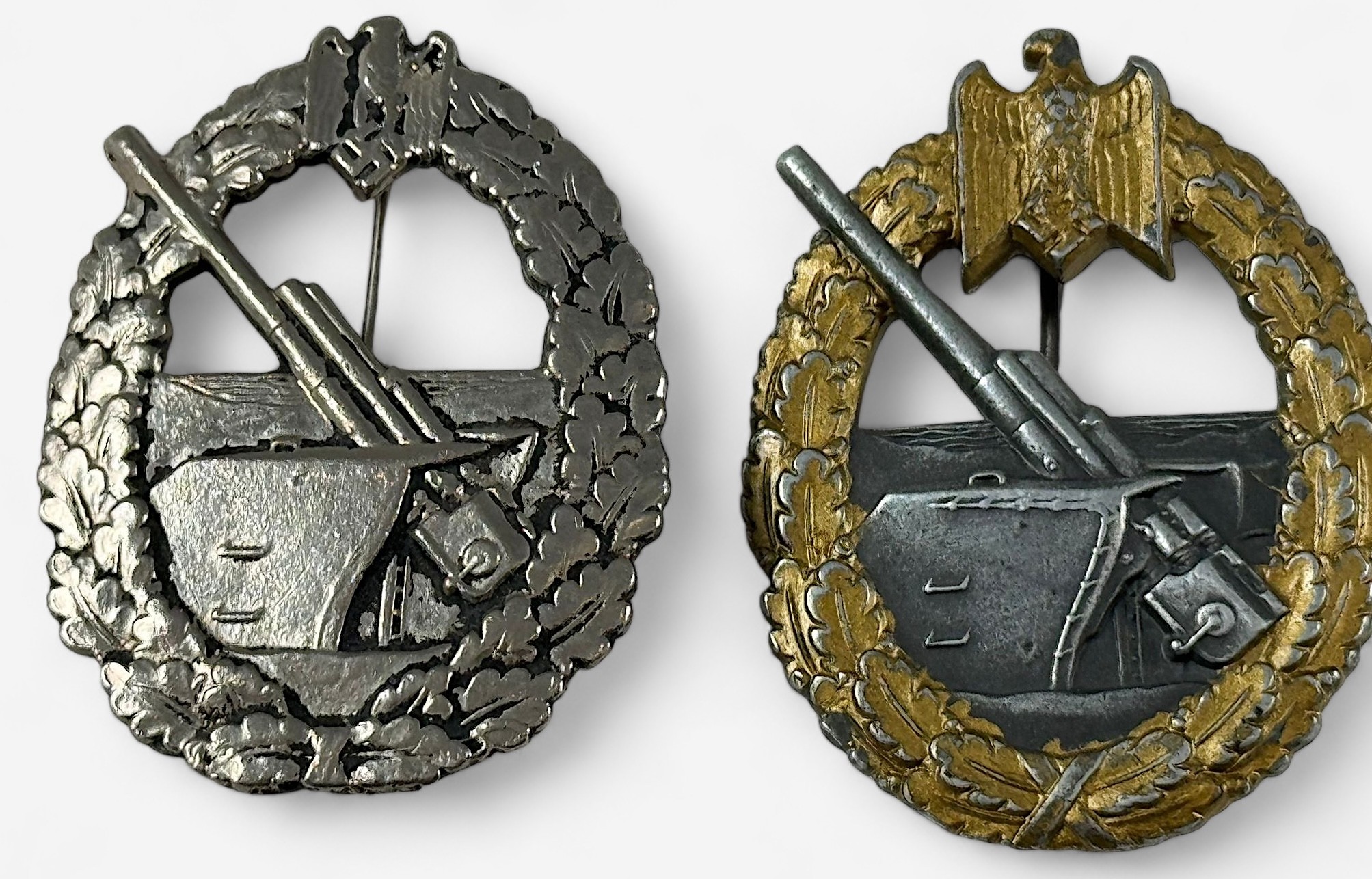 A German WWII Kriegsmarine Coastal Artillery badge, part-gilt alloy, marked FLL 43 to reverse (