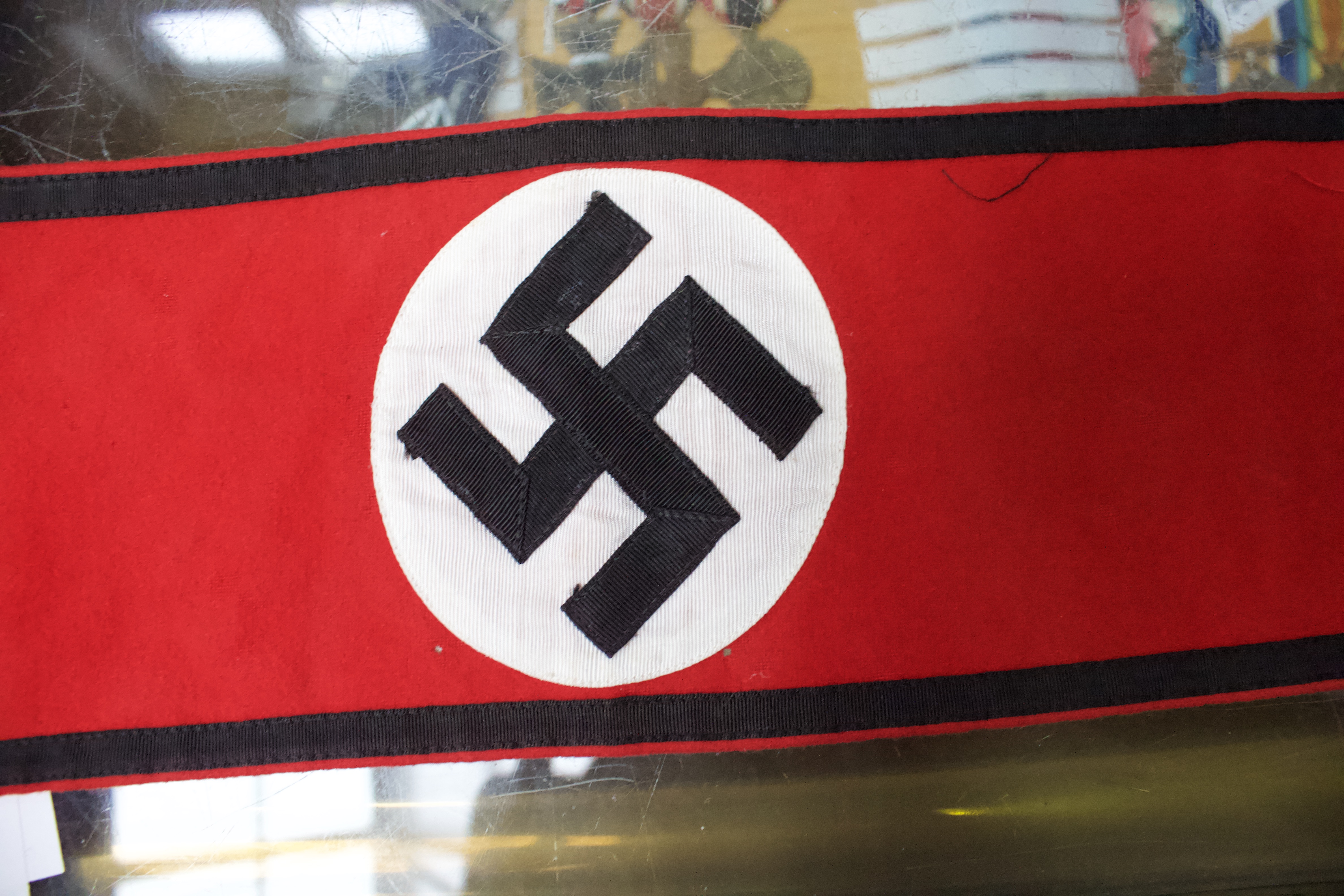 A WWII German Third Reich Swastika pennant, together with an armband, another felt armband and flag. - Image 2 of 8