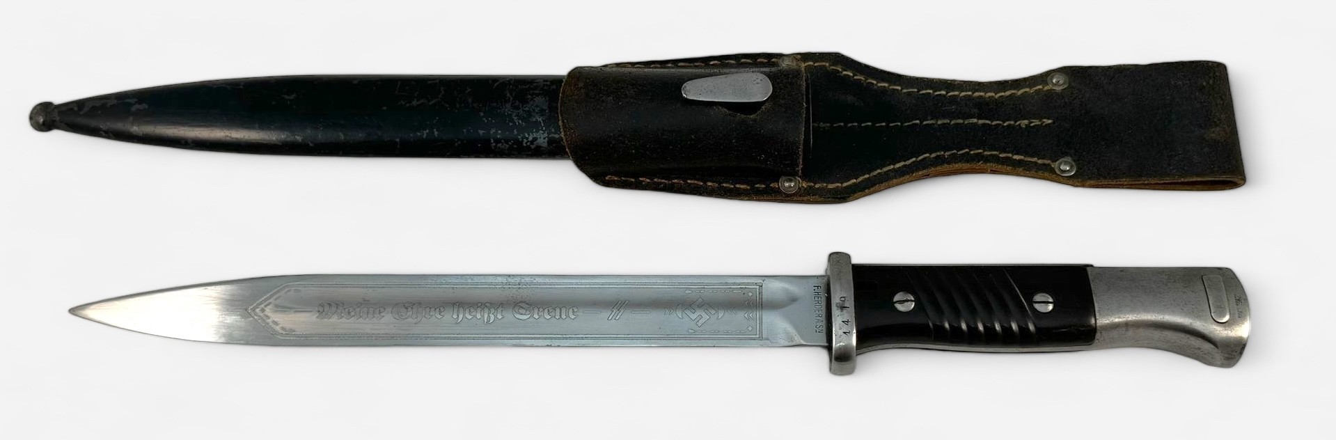 A WWII German Waffen SS bayonet, 25cm fullered blade, etched 'meine ehre heißt treue' (my honour