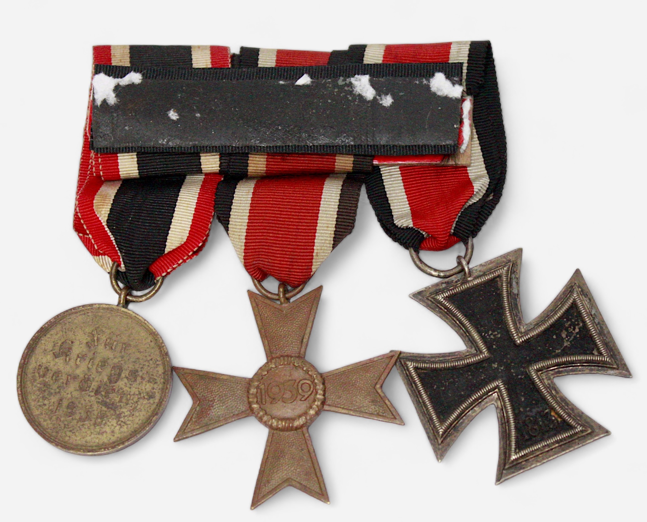 A German WWII three medal group, comprising Iron Cross, 2nd Class, War Merit Medal and War Merit - Image 2 of 2