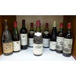 A collection of ten assorted bottles of vintage red wine including a 1973 vintage Saint Nicolas