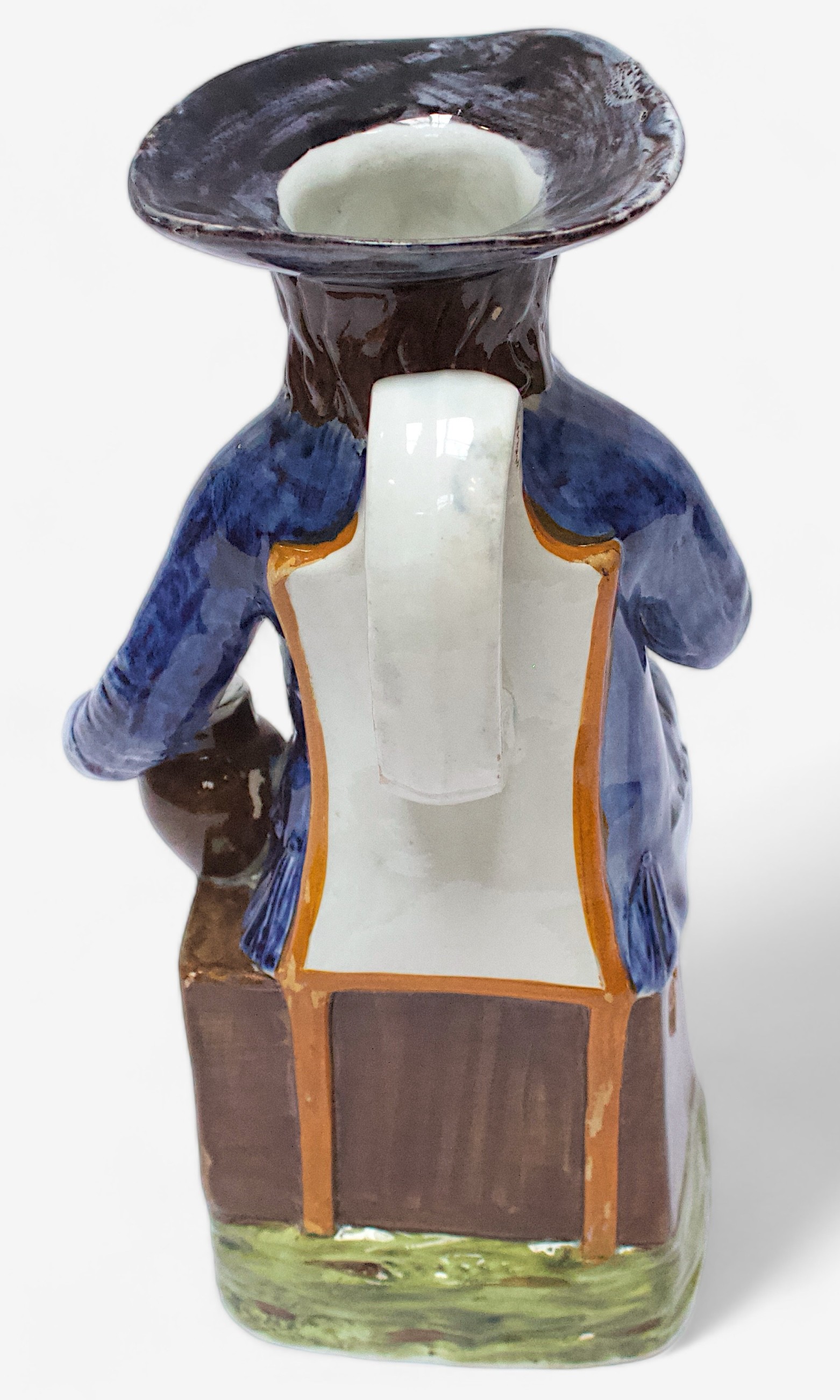 A Prattware ‘Sailor’ toby jug, c1790-1810, blue frockcoat and britches, waistcoat painted with - Image 3 of 4