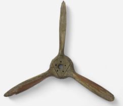 An early 20th Century three-blade wooden propeller, nine interlocking laminate mahogany