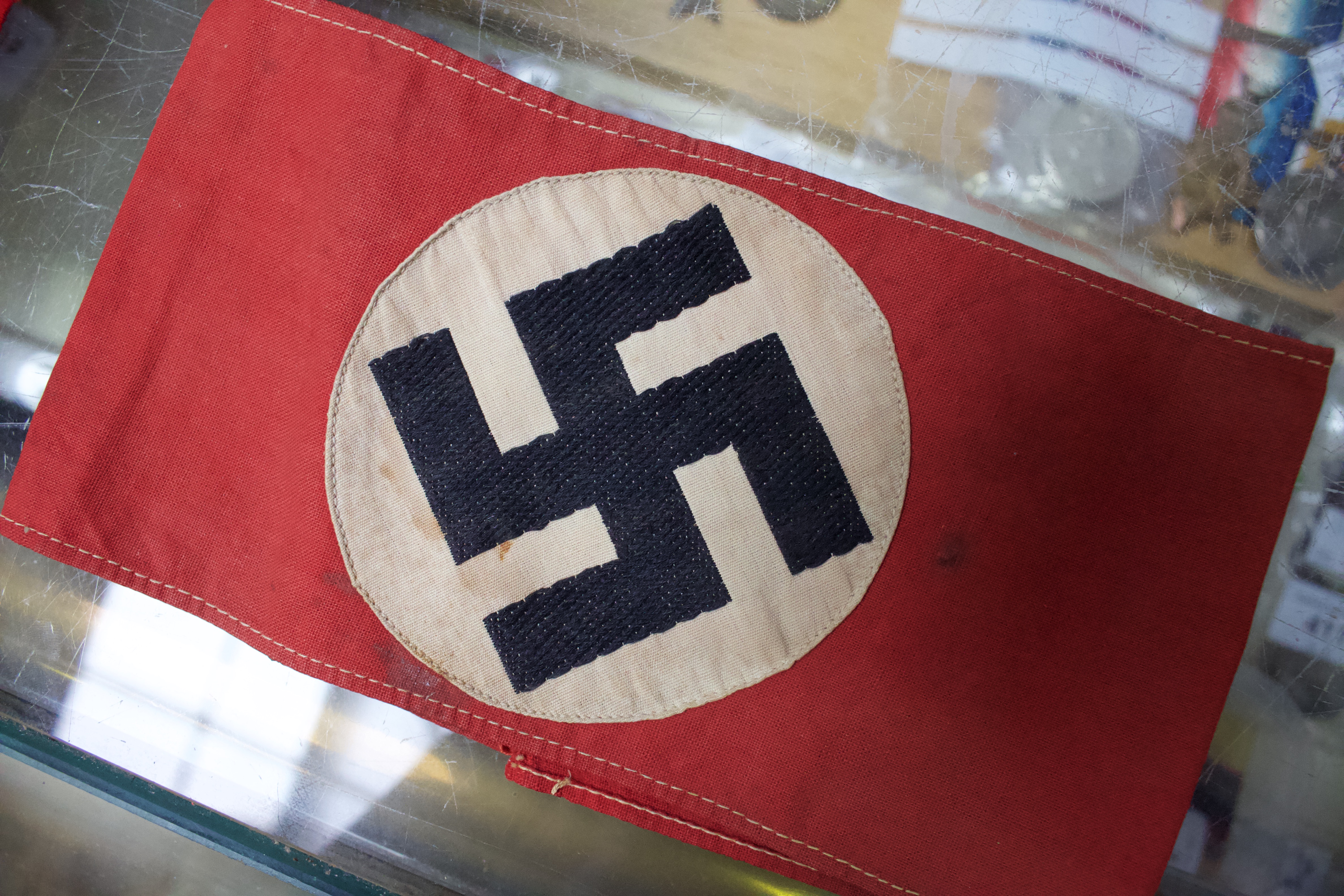 A WWII German Third Reich Swastika pennant, together with an armband, another felt armband and flag. - Image 3 of 8