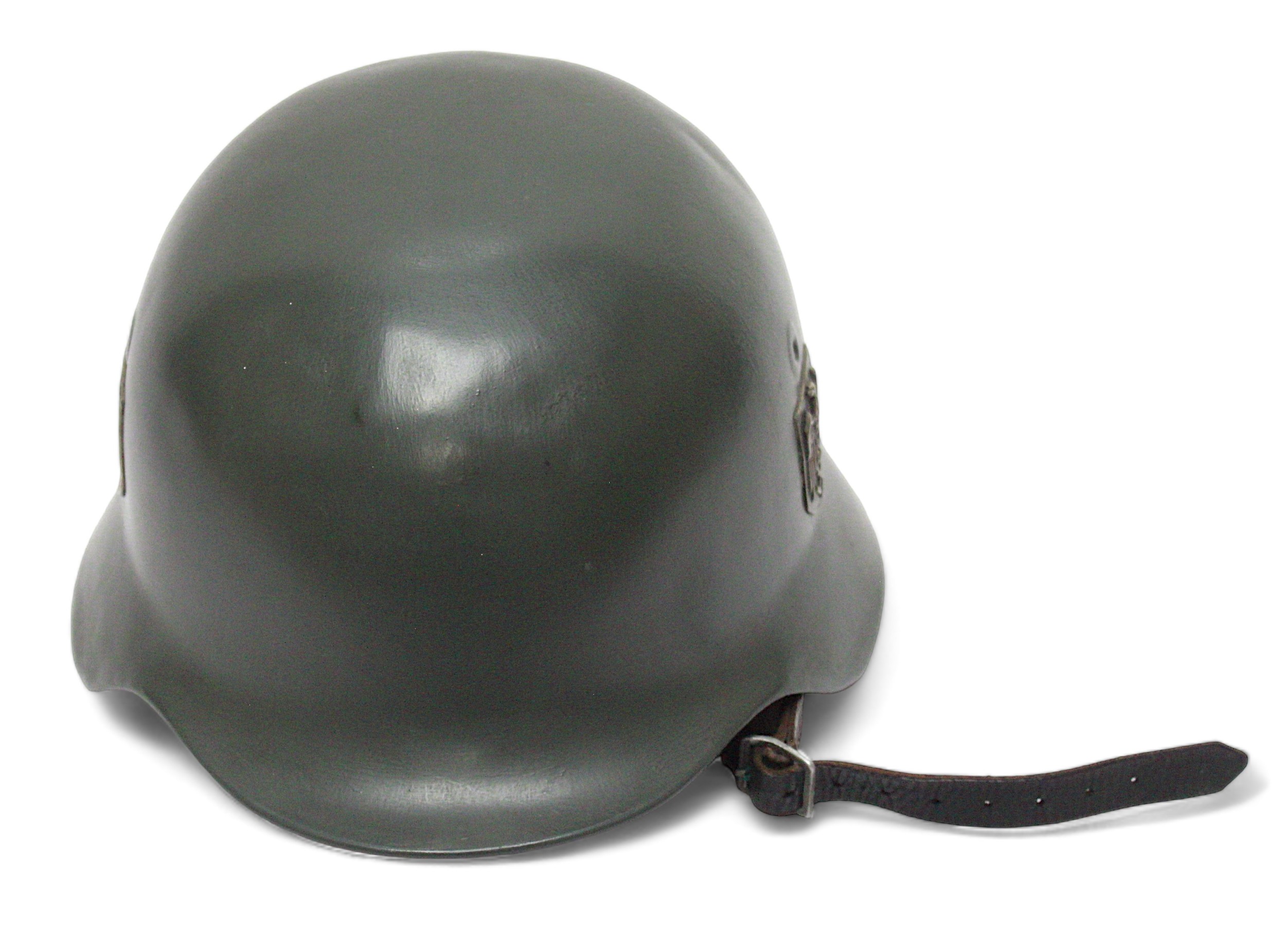 A WWII German Third Reich M40 helmet, with nine-tongue leather liner, repainted green and later