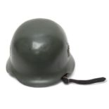 A WWII German Third Reich M40 helmet, with nine-tongue leather liner, repainted green and later