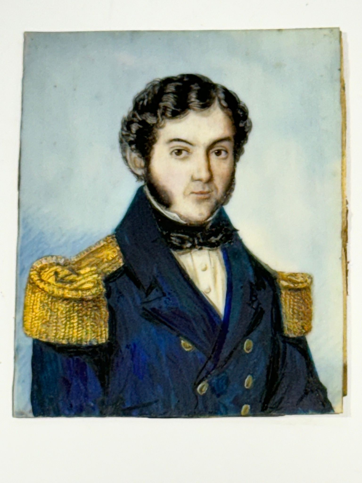 A Mid-19th century rectangular portrait miniature of a Naval Commander, with black curly hair and - Image 2 of 2