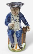 A Prattware ‘Sailor’ toby jug, c1790-1810, blue frockcoat and britches, waistcoat painted with