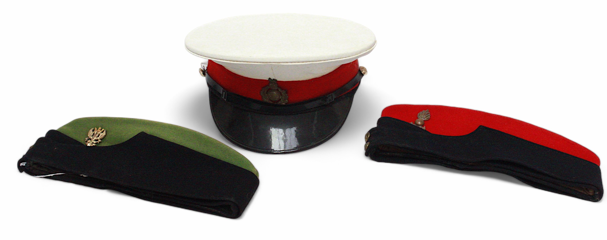 A Royal Marines peaked dress cap with cap badge, a green and black side cap with Mercian regiment