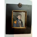 An early 19th century portrait miniature of a Senior Naval Officer, with medium length wavy black