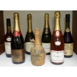 A collection of assorted champagne and liqueurs, comprising Benedictine D.O.M., in original paper,