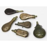 Six various powder flaks, including three pressed sheet brass, one leather and one horn example. (