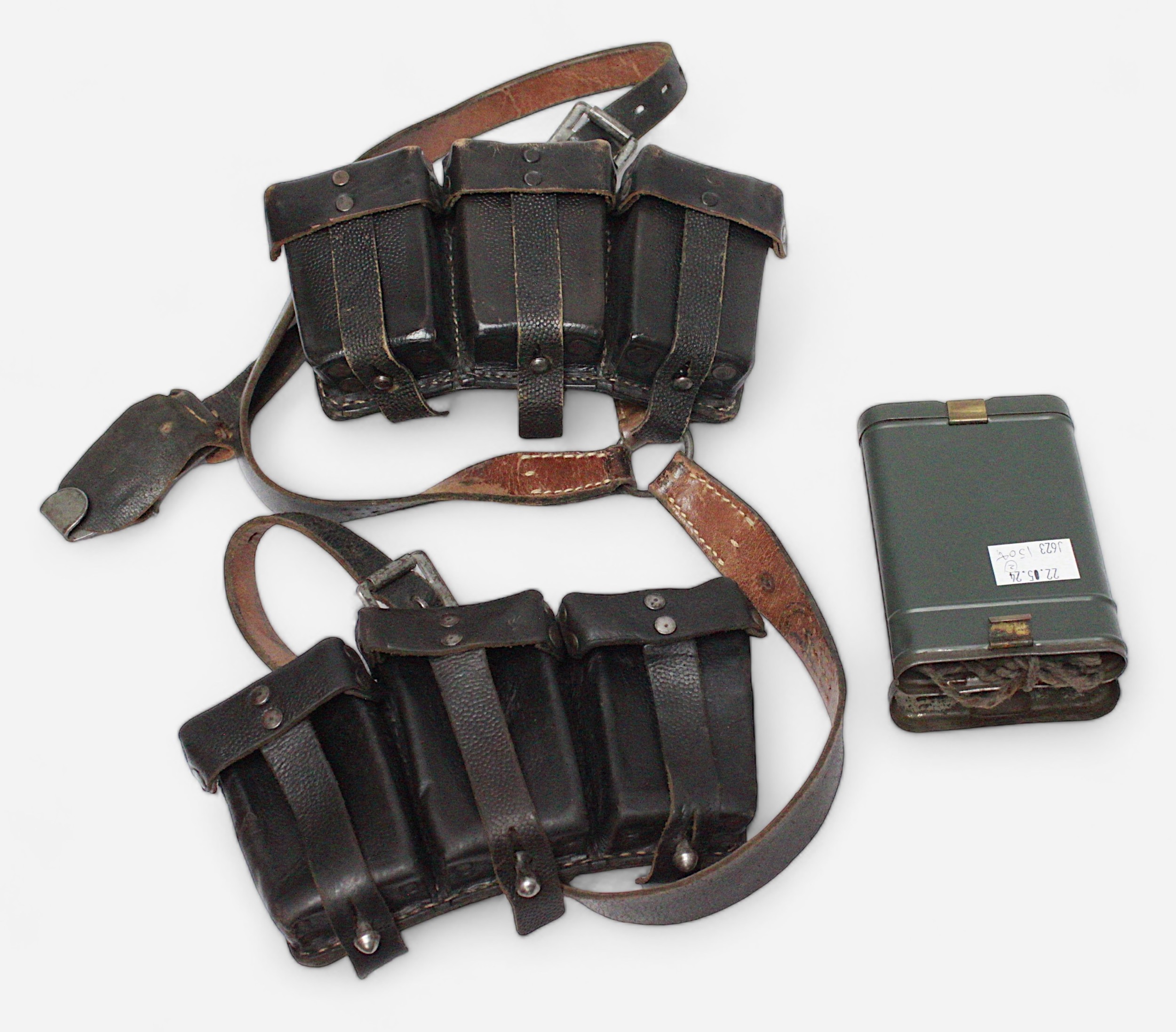 A WWII German Third Reich leather six-pouch ammunition belt, with Reichsadlet Eagle stamp,