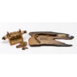 HMS Invincible 1744 Interest: A rigging truck on stand and a hand-forged copper staple mounted on