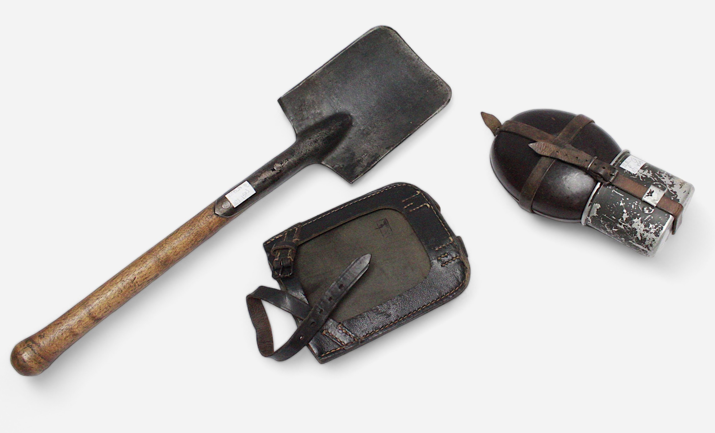 A WWII German entrenching tool with leather sheath stamped with Reichsadler Eagle, and German