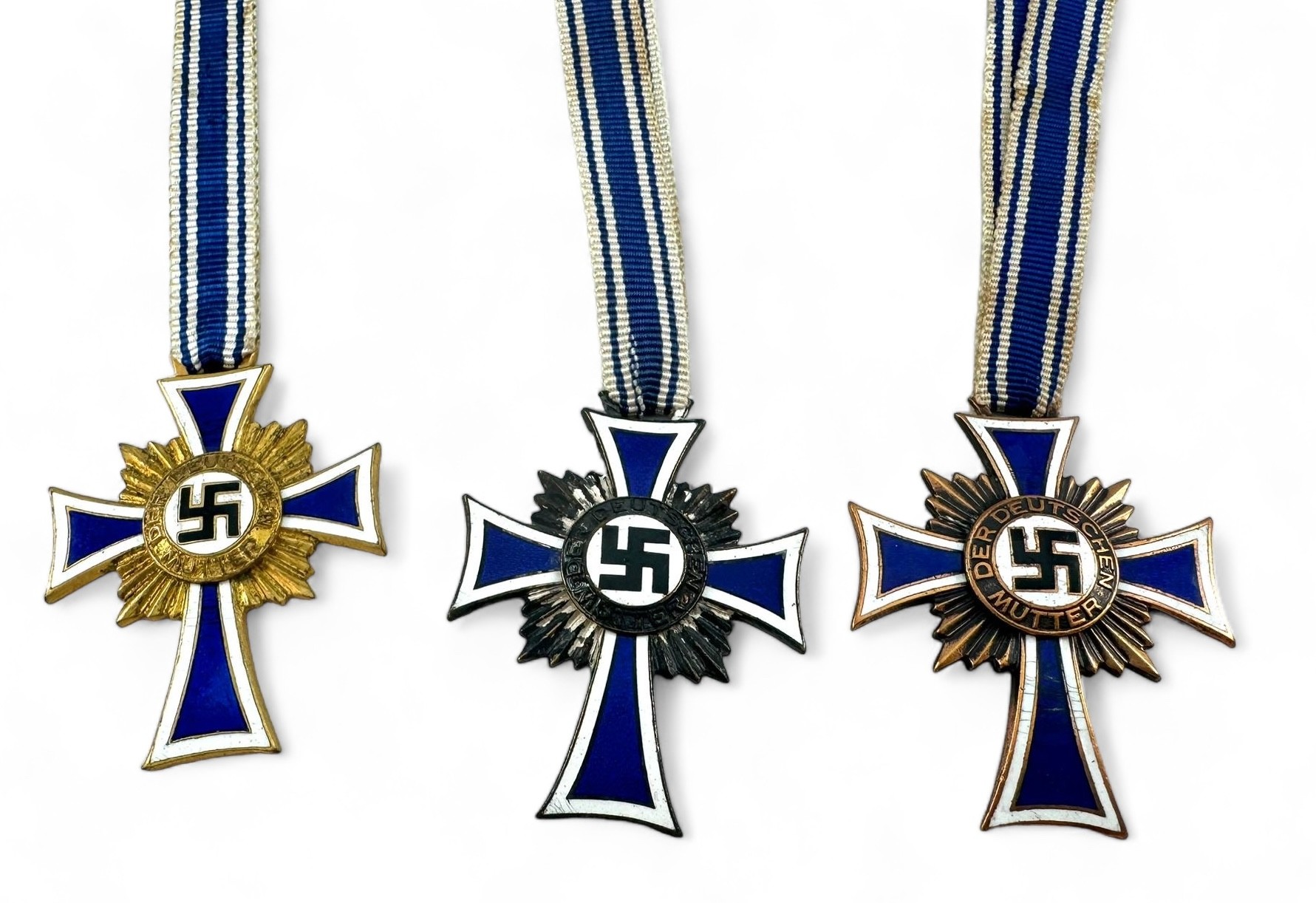 Three German Third Reich Mother's Crosses, with ribbons.