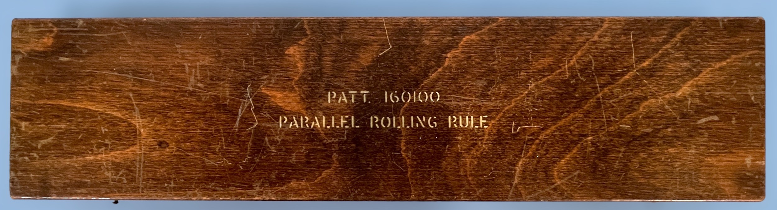 An Admiralty pattern sliding parallel rolling rule, 160100, by WH.Harling, with 'Broad arrow' mark - Image 2 of 2