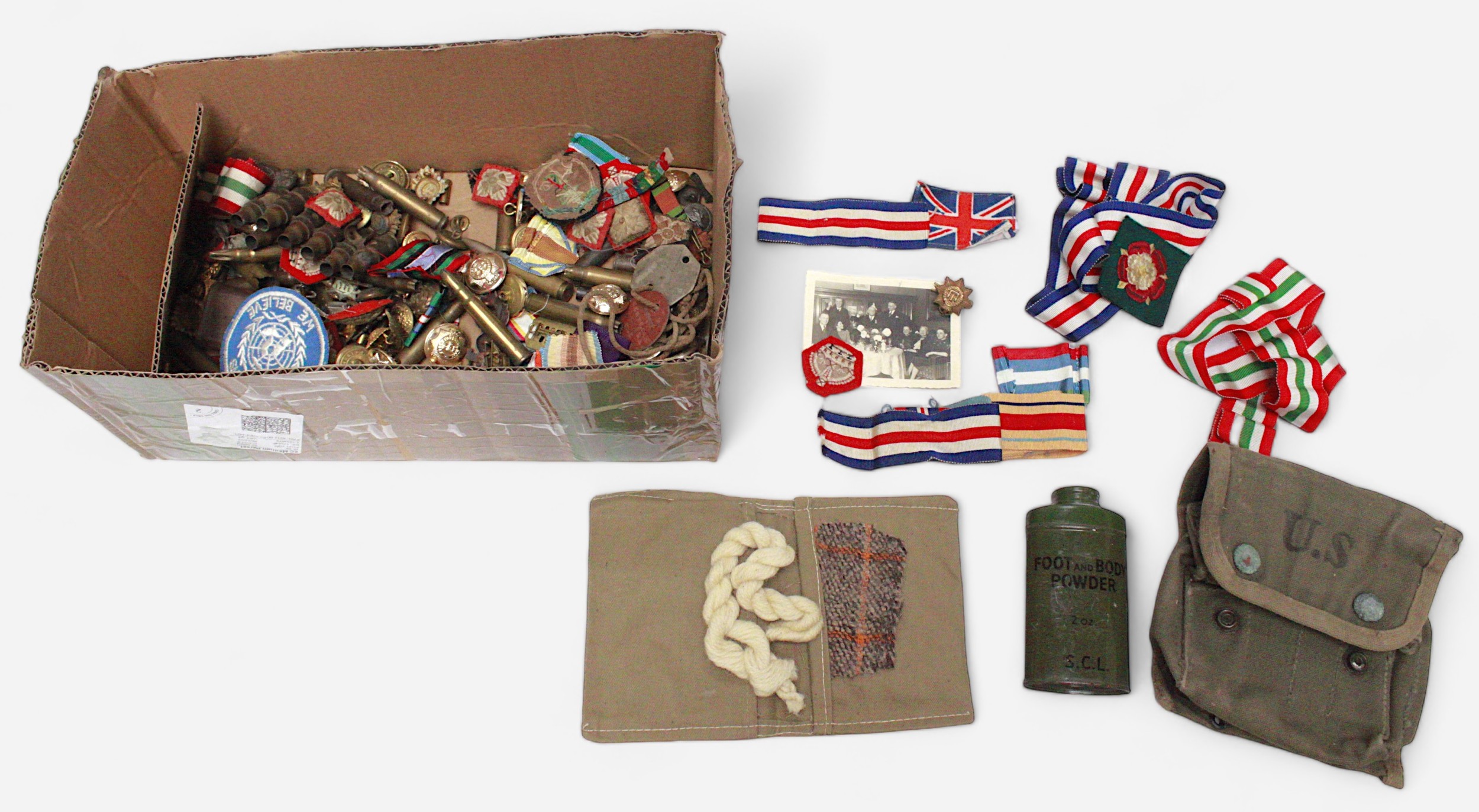 A collection of assorted military and naval buttons, patches and cap badges including Devon, Oxf&