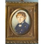 A 19th century oval portrait miniature of a young Naval Midshipman, with light brown long wavy hair,