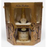 A commemorative Millenium magnum bottle of Nicolas Feuillatte champagne, with a set of 12 flutes, in