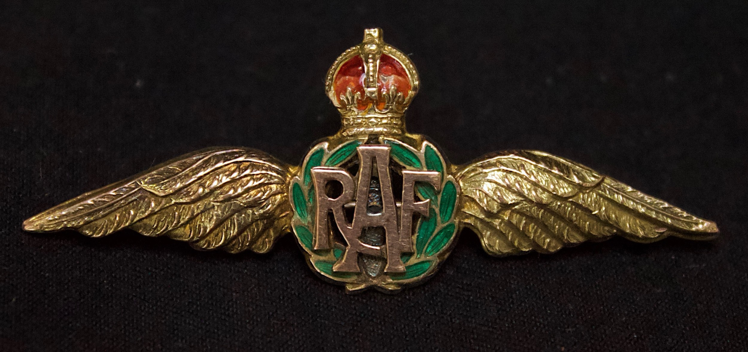 A 9ct gold and enamel RAF Sweetheart Brooch, with 'RAF' monogram within green laurel wreath below