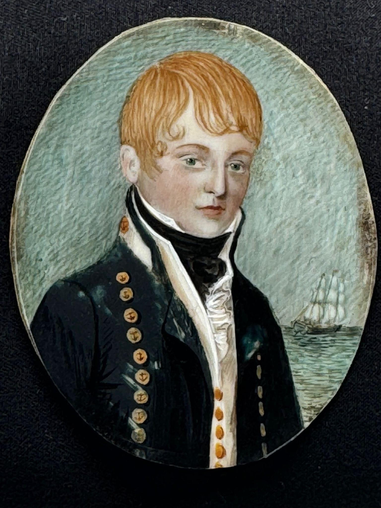 A 19th century oval portrait miniature of a young Naval Midshipman, with red hair, body turned - Image 2 of 2