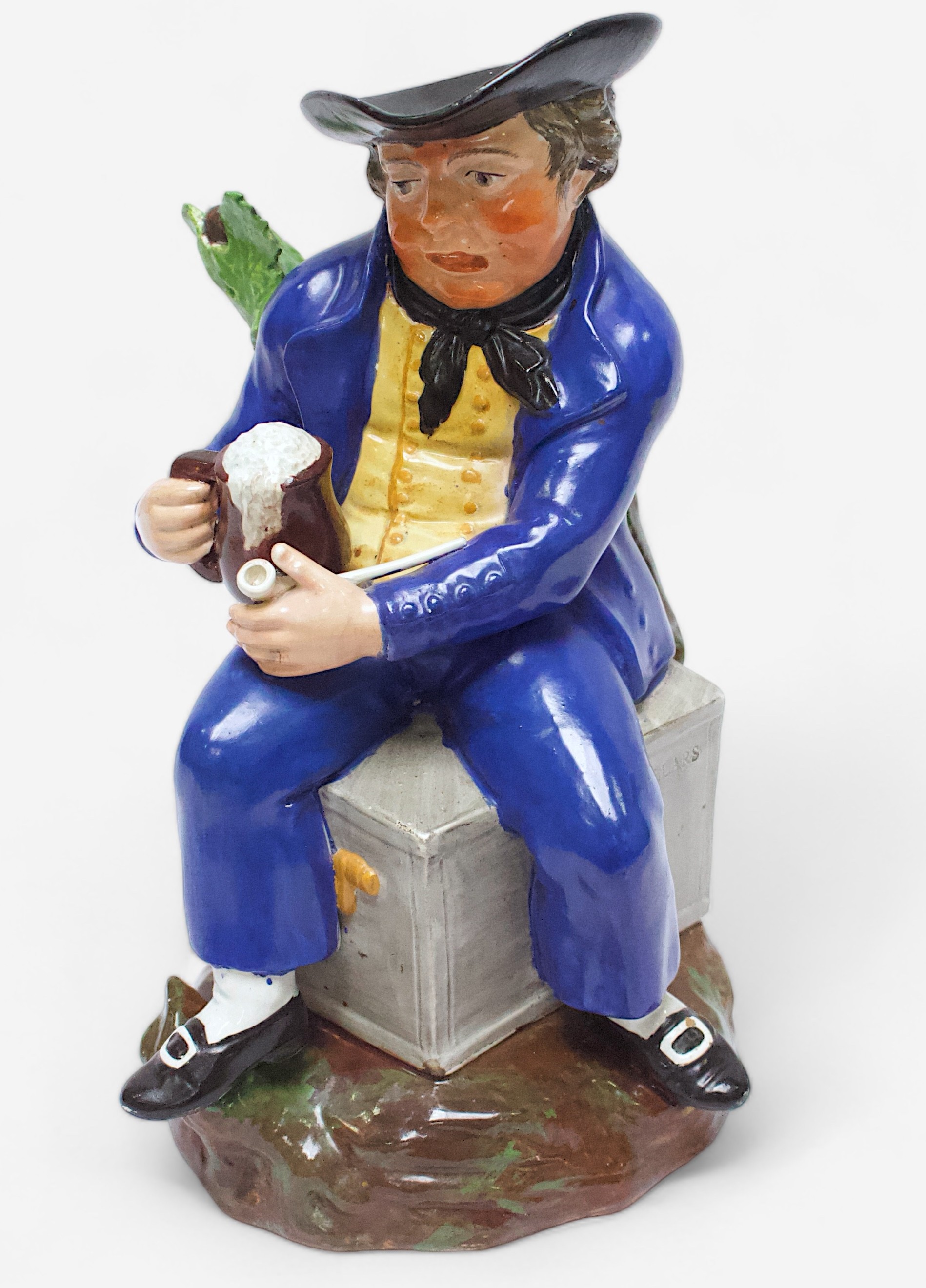 A 19th Century unmarked and heavily potted Staffordshire Pearlware toby jug of an ‘American Sailor,’