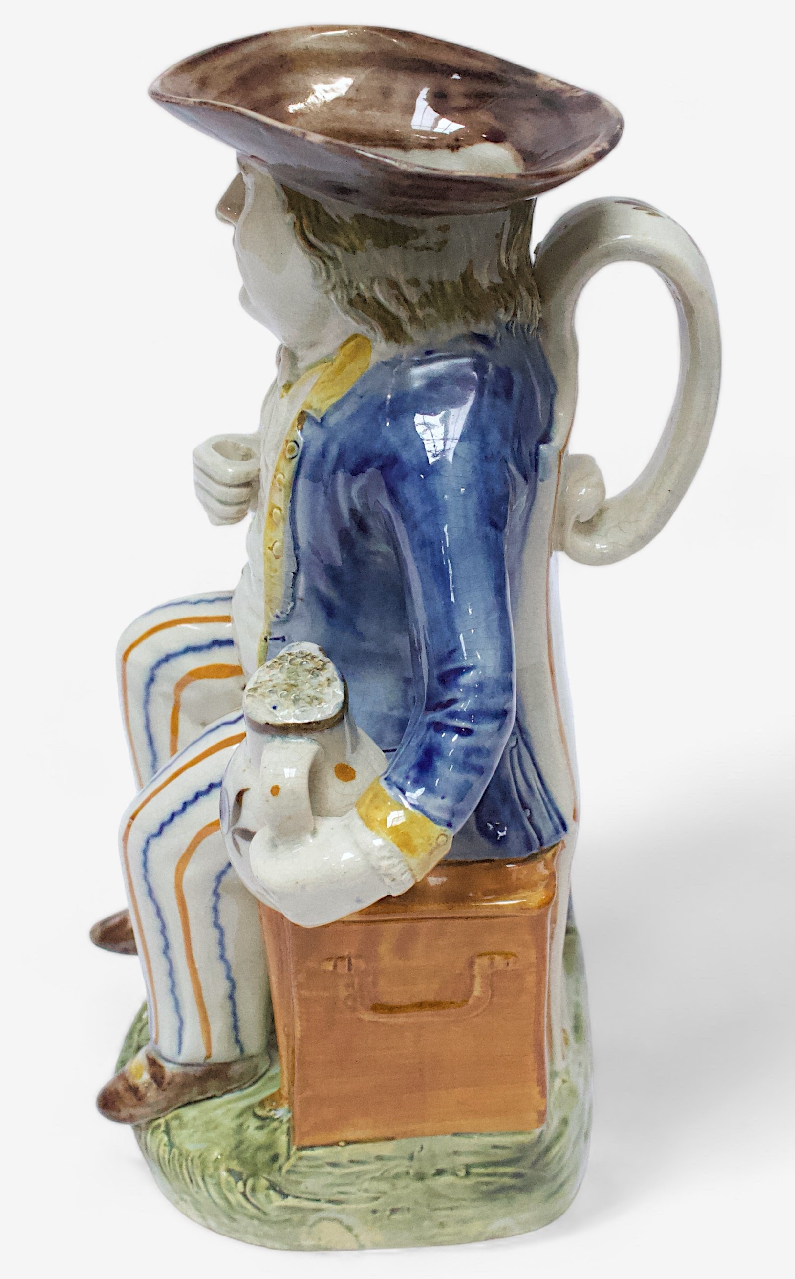 A Prattware Pottery ‘Sailor’ toby jug, c1790-1810, seated holding a jug, striped britches, blue coat - Image 4 of 4