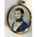 An early 19th century oval locket-back portrait miniature of a Junior Naval officer, with dark brown