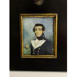 A Mid-19th century portrait miniature of a Naval Midshipman, with black wavy hair wand sides brushed