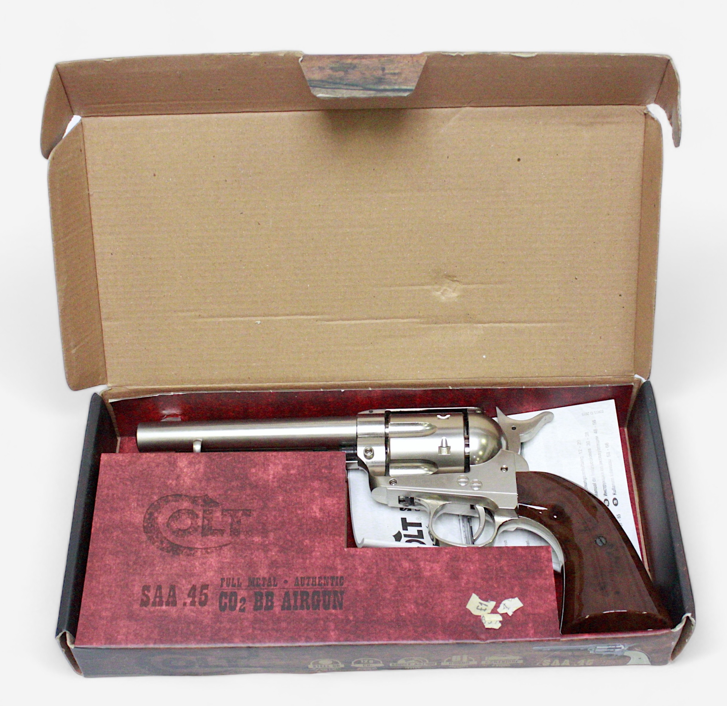A Colt SAA. 45 CO2 Revolver, with nickel finish and wood effect grip. Calibre .177 pellet, in