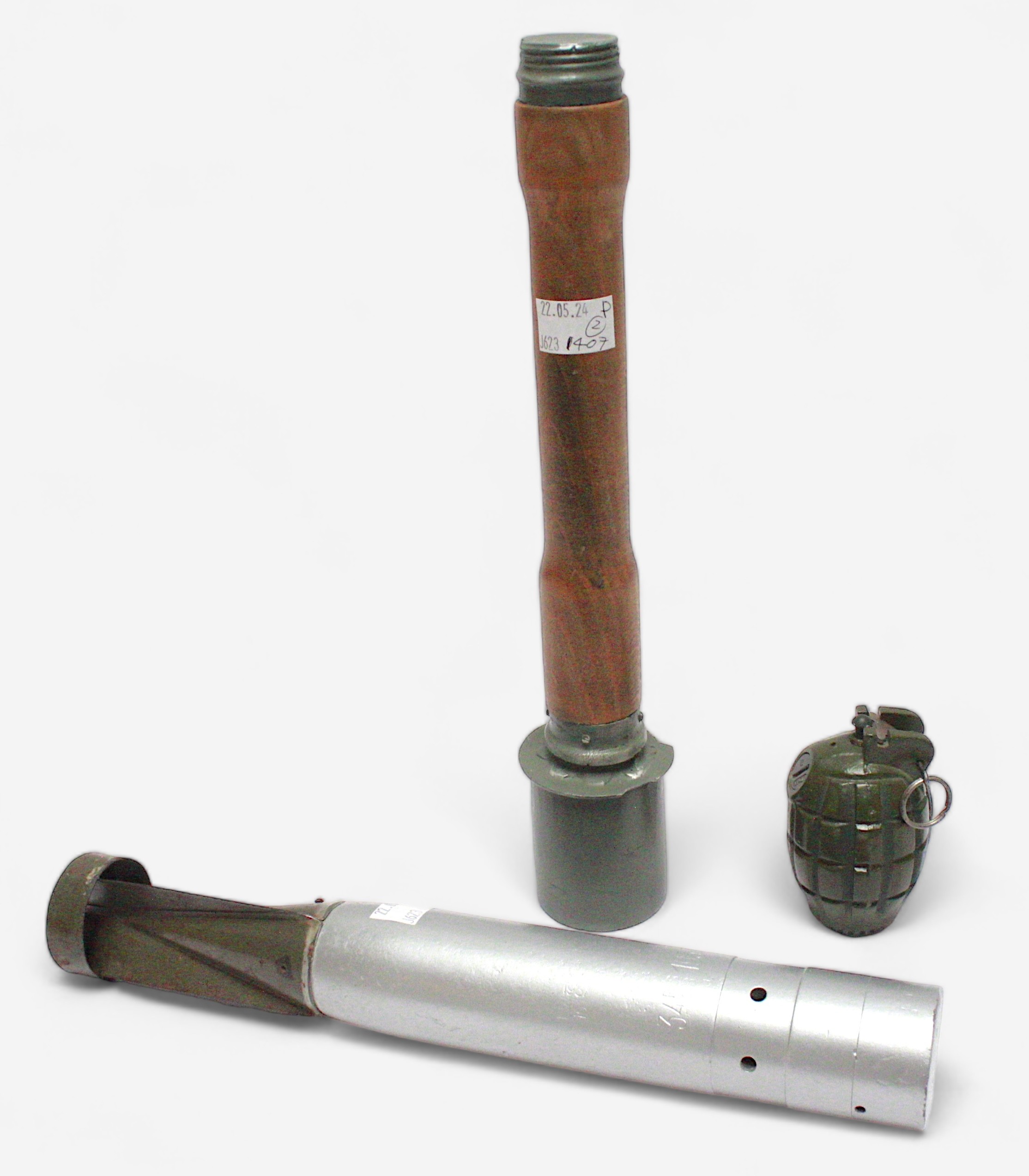 A WW2 period deactivated German incendiary bomb, and 'replica' German WWII type M23 stick grenade,
