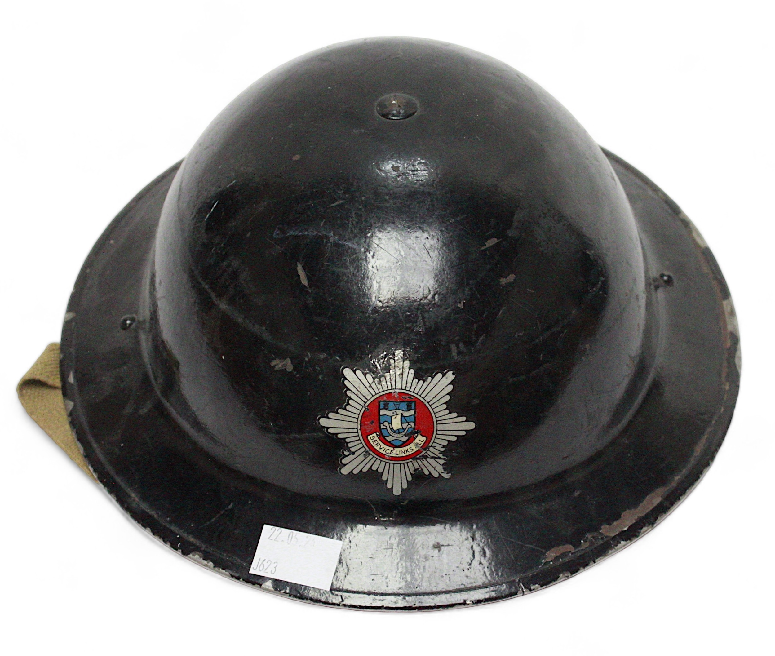 A black painted British WWII fire brigade steel helmet, with decal to front, numbered 431194 to