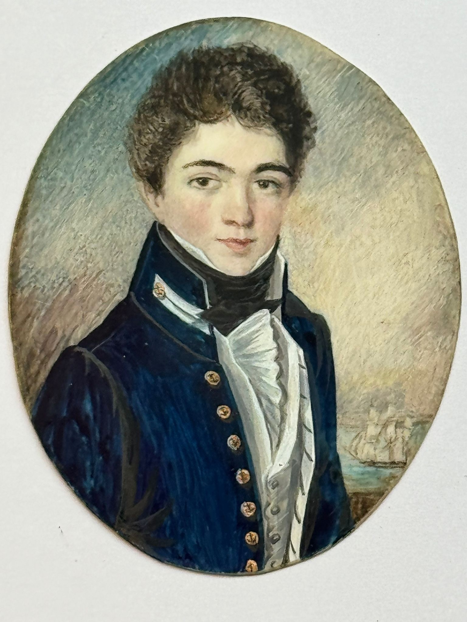 An early 19th century oval portrait miniature of a Junior naval officer, inscribed verso ‘c.1810,’ - Image 2 of 2