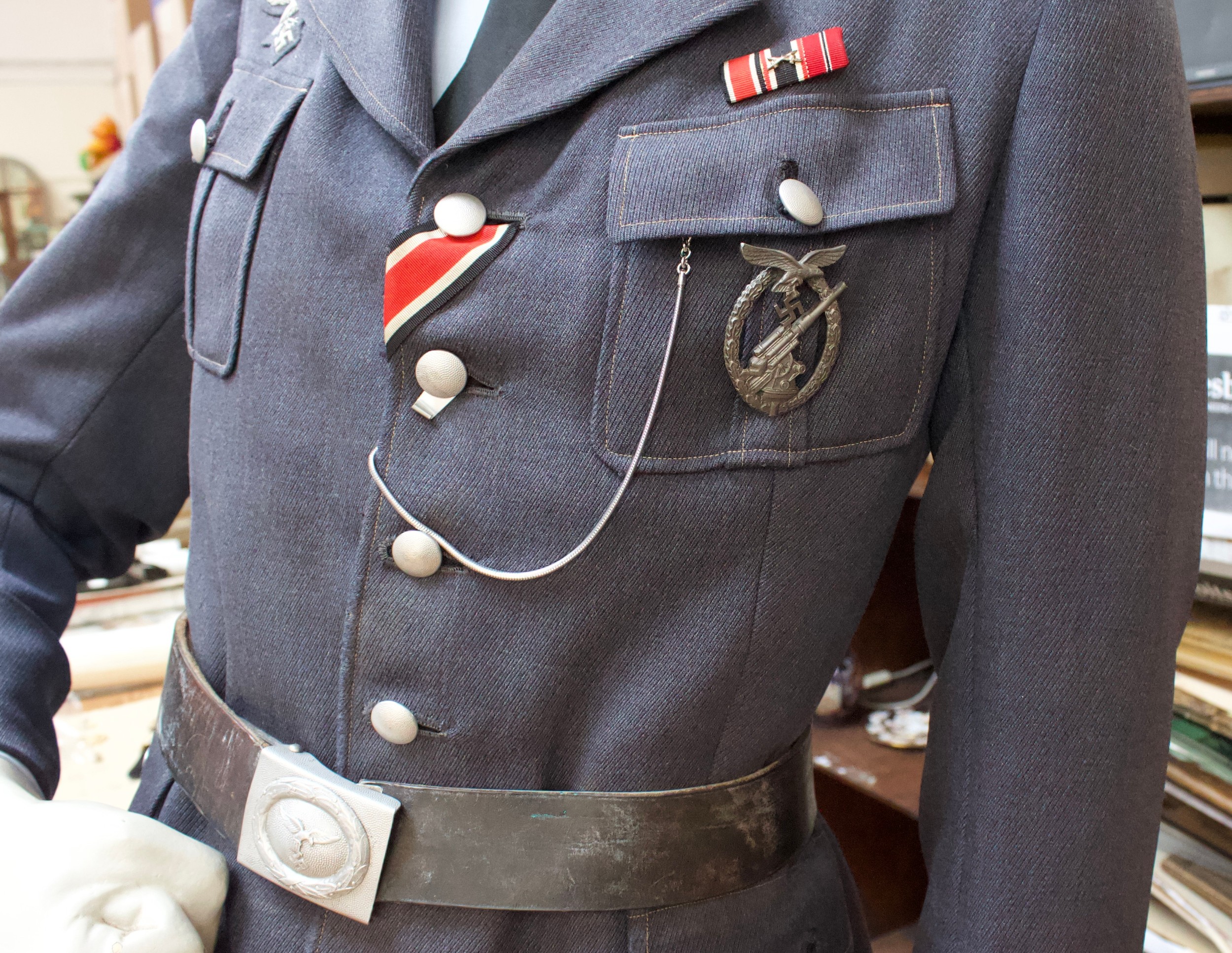 A WWII German Third Reich Luftwaffe uniform on mannequin dummy, comprising peaked cap, jacket with - Image 4 of 5