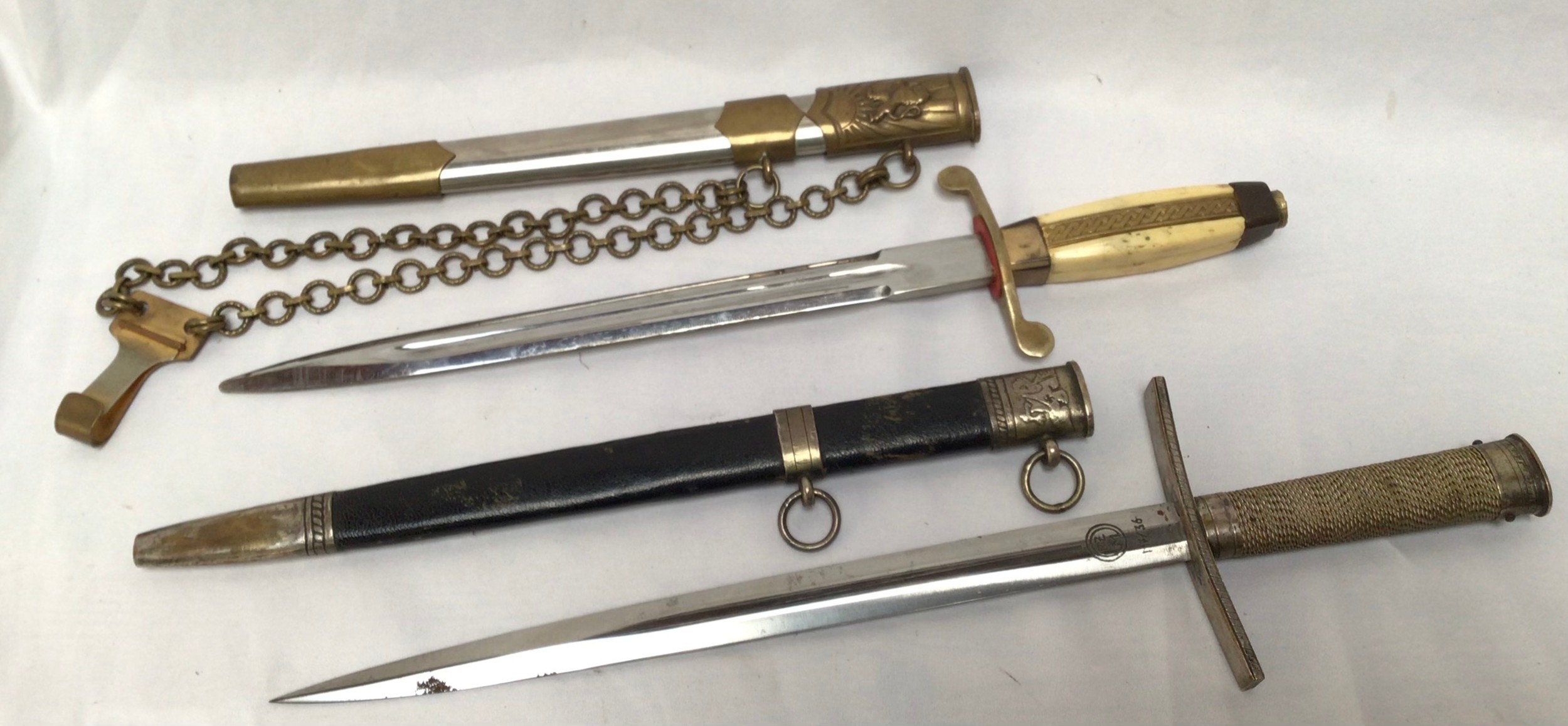 A Hitler Youth Leader's 'style' dagger and a Bulgarian officer's dress dagger. (2)