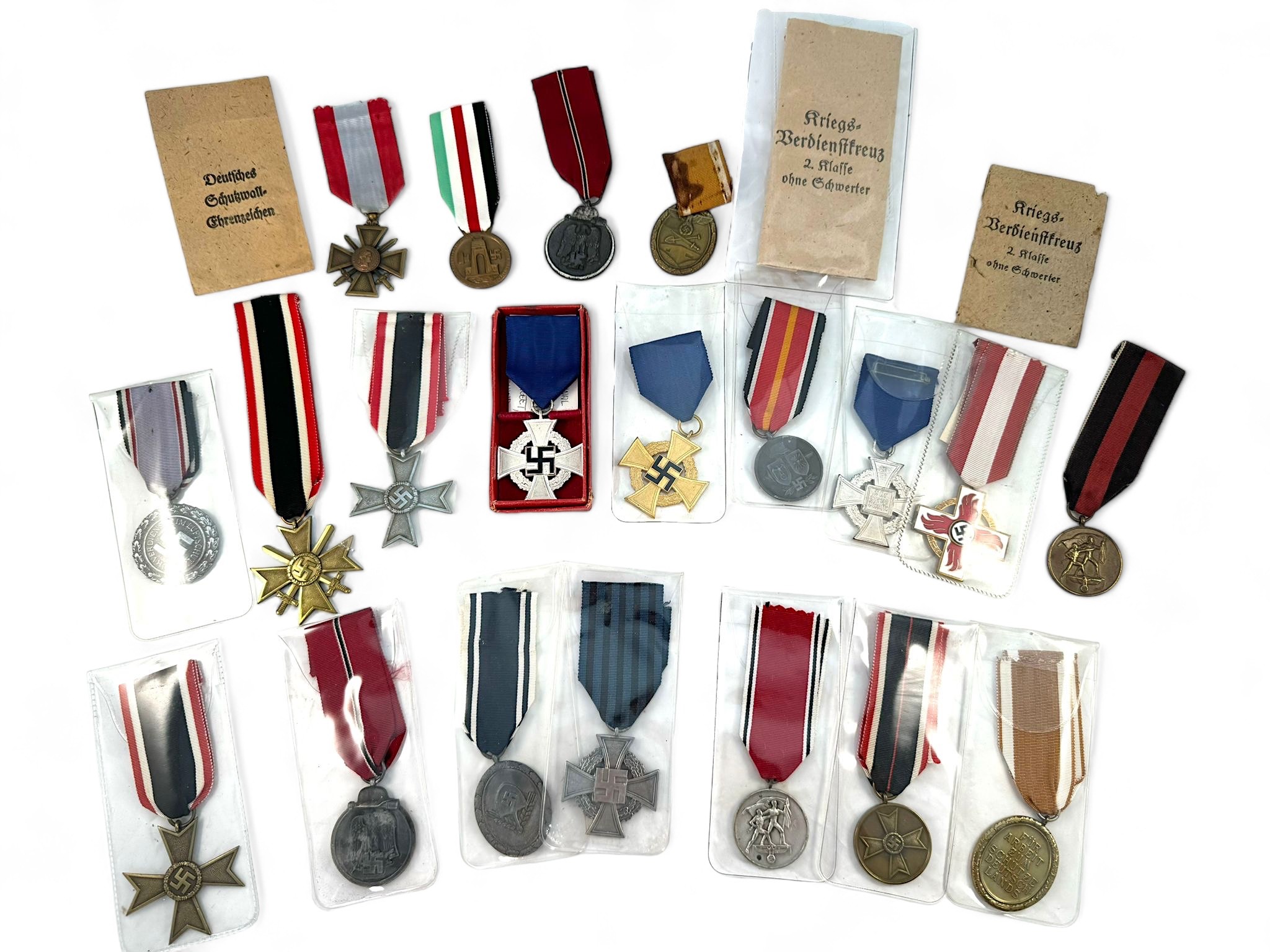 Twenty various WW2 German Third Reich badges Eastern Front Service and awards for loyalty, long