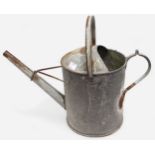 A WWII German Third Reich galvanised metal 2 Gallon watering can, the base embossed with a Swastika.