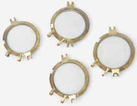 A set of four heavy brass port holes, the glass etched ‘Hardglas Holland’, 31cm diameter excluding