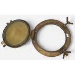 An antique brass ship’s porthole, with lockable, circular, hinged window, backplate measures 38cm