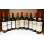 A collection of nine bottles of vintage red wine including two bottles of Chateau La Croix