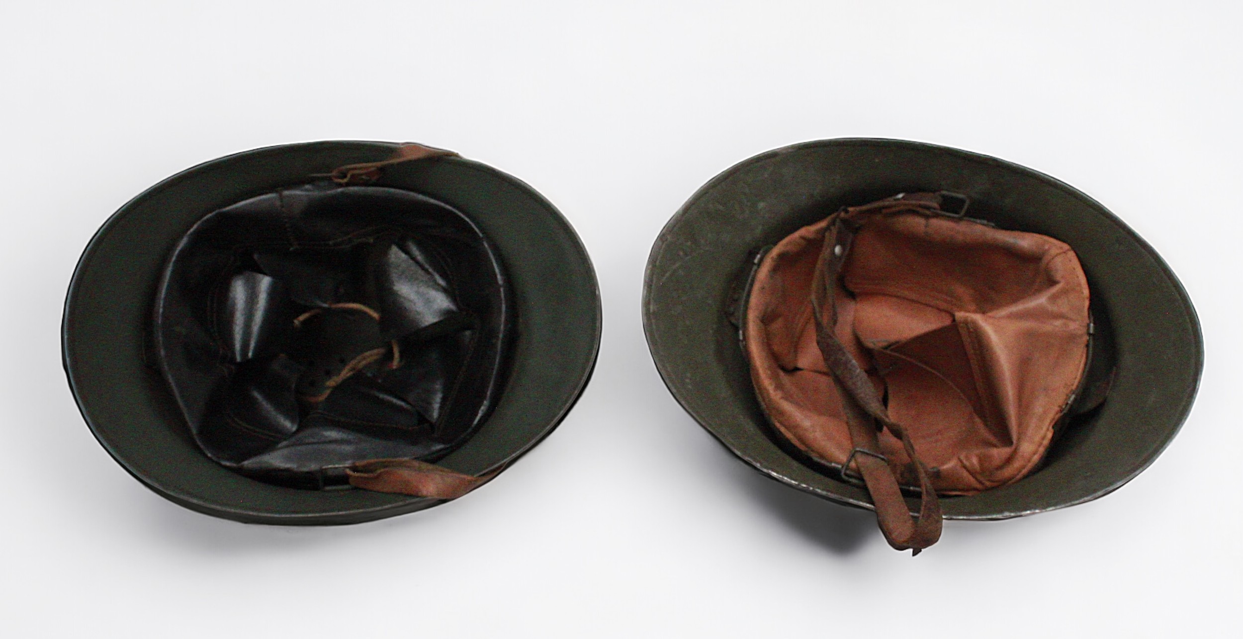 Two French WWI era steel Adrian type helmets, both with leather linings and chin straps, one with - Image 2 of 2