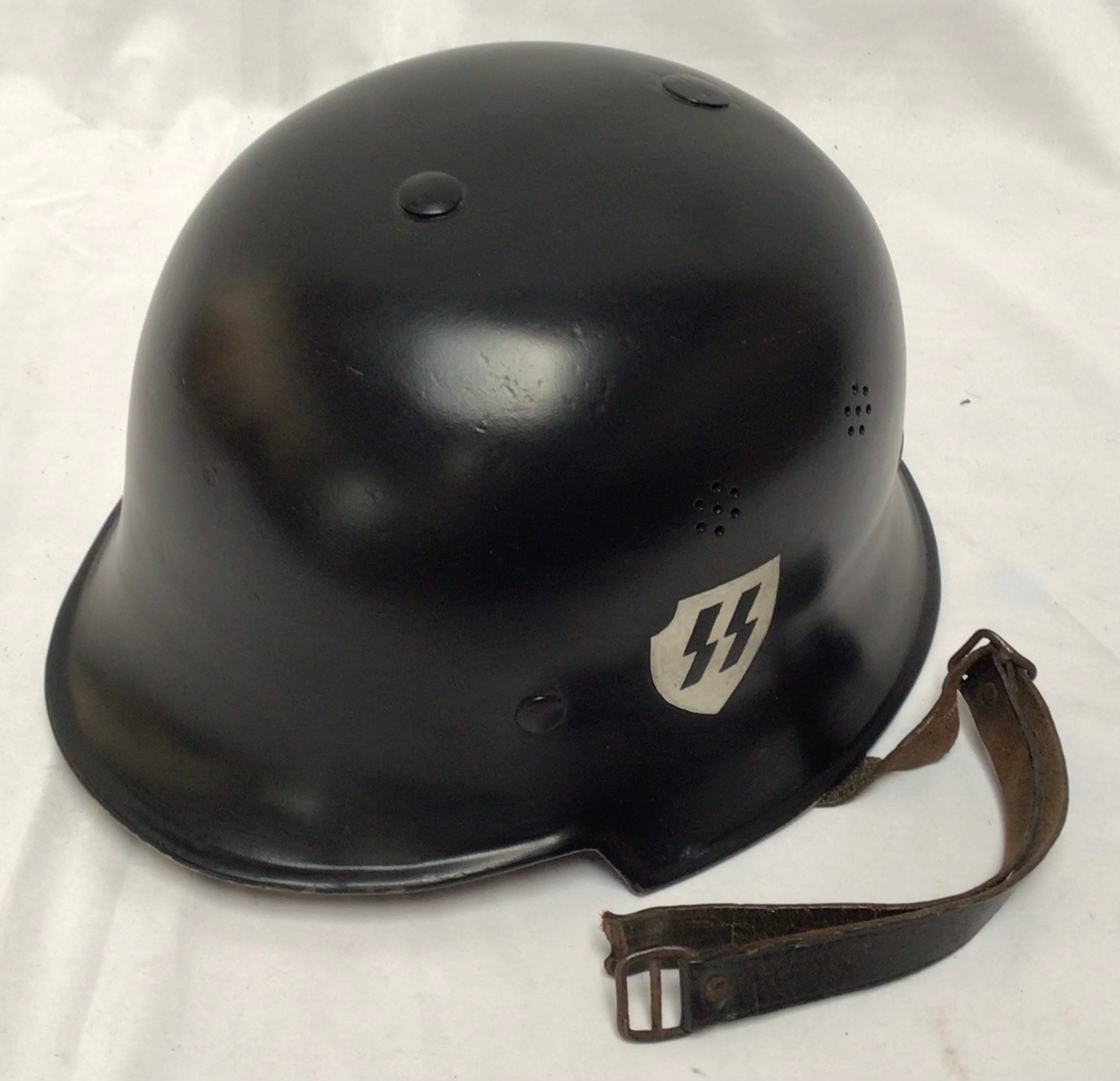 A WWII German Third Reich M34 Civil Defence Feuerwehr (Fire Service) Helmet, black painted with