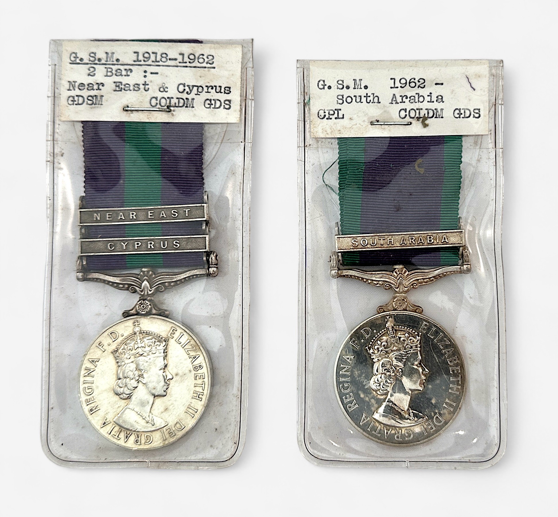 Two various ERII Coldstream Guards Genral Serrvice Medals 1918-1962 GSM with Near East and Cyprus
