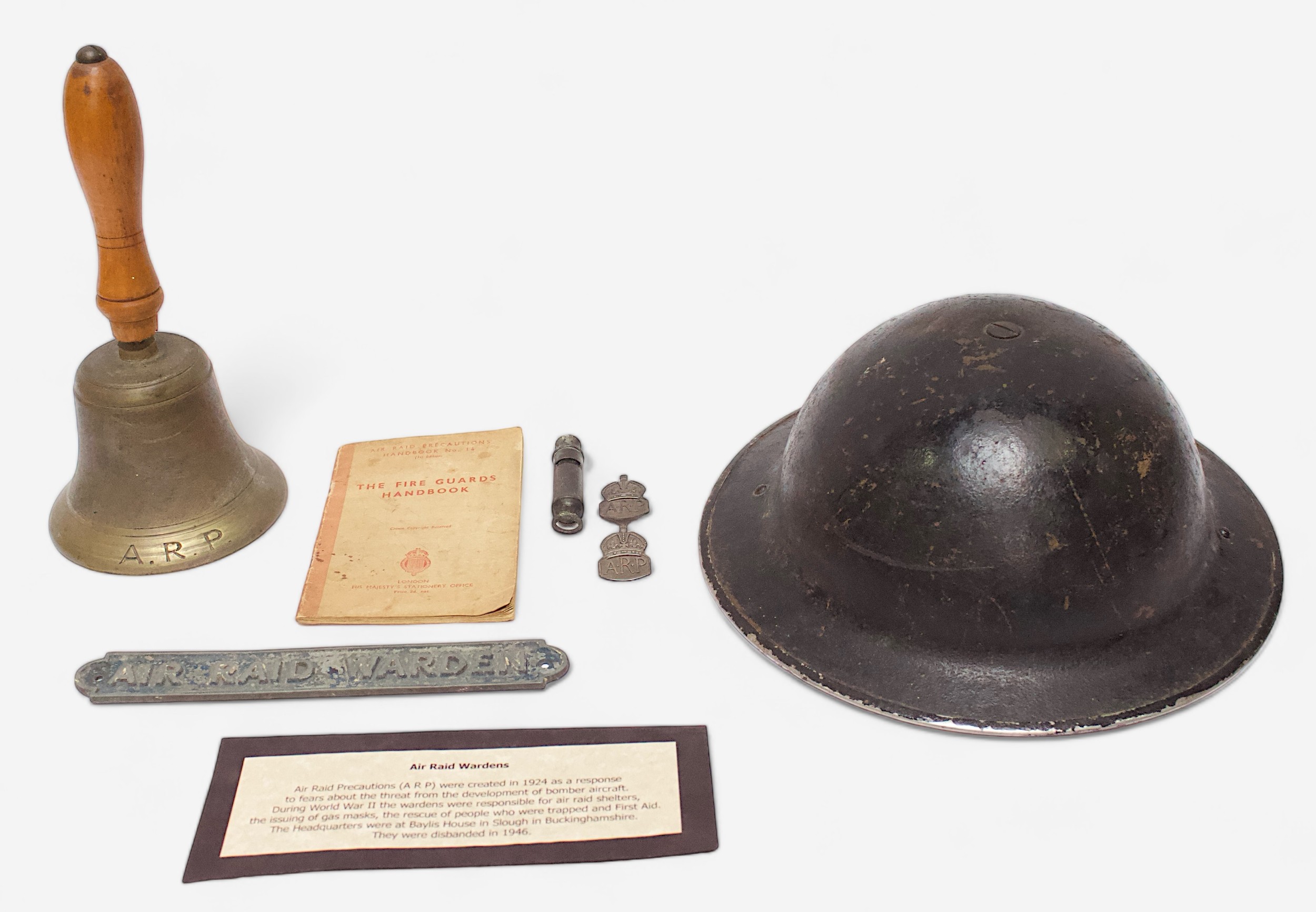 A collection of British WWII Air Raid Precautions (ARP) collectables, comprising a black painted