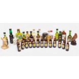 A collection of assorted alcohol miniatures, comprising a case of twenty-four Guinness Foreign Extra