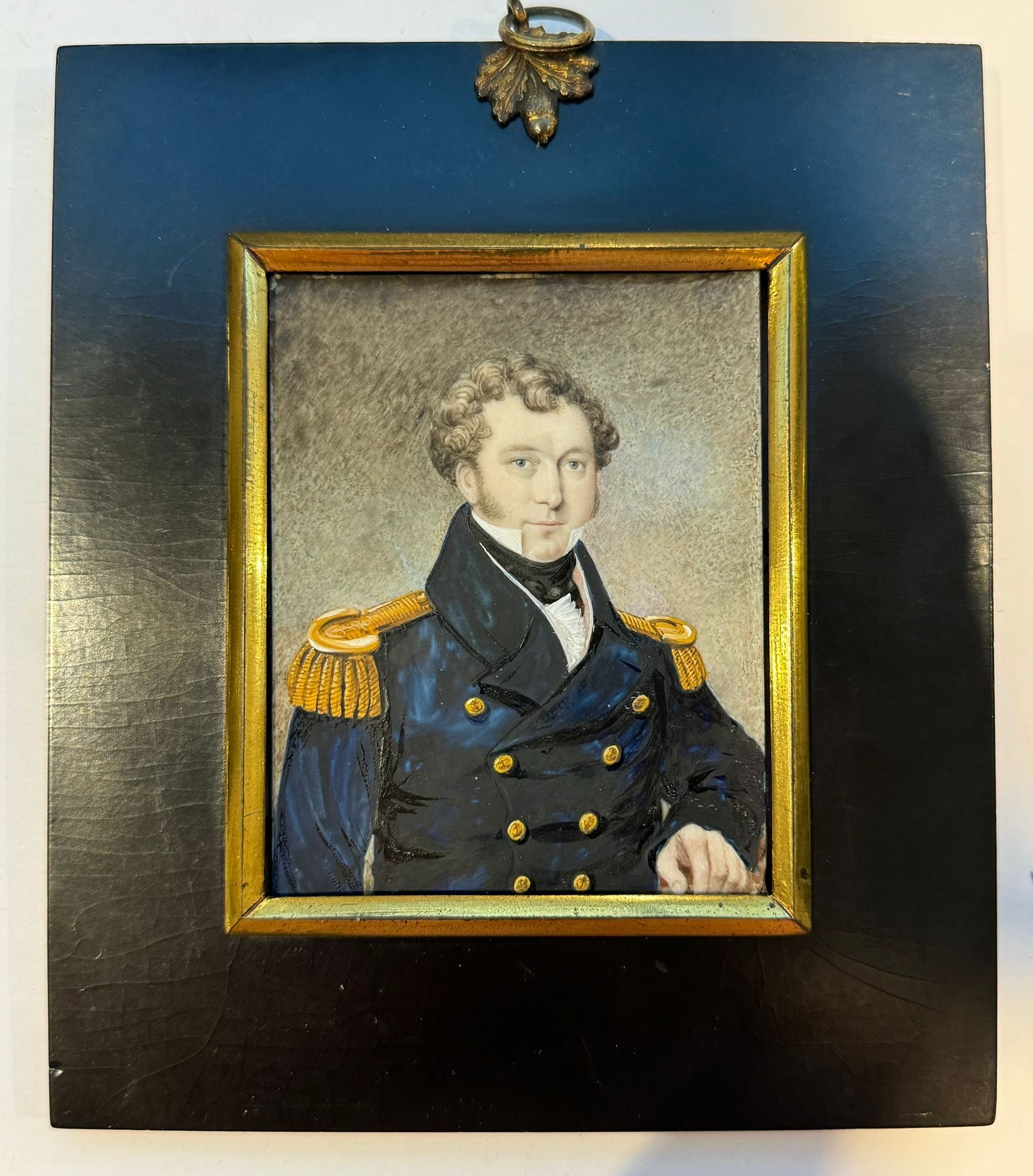 A Mid-19th century portrait miniature of a Naval Commander or Captain, with slightly receding