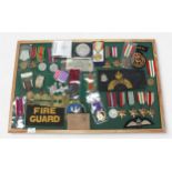 A collection of WW2 British medals, various replica medals, Civil Defence and Fire Guard armbands,
