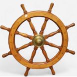 An eight spoke oak ships wheel, with brass central hub and cone, and flush brass screws, 108cm