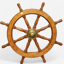 An eight spoke oak ships wheel, with brass central hub and cone, and flush brass screws, 108cm